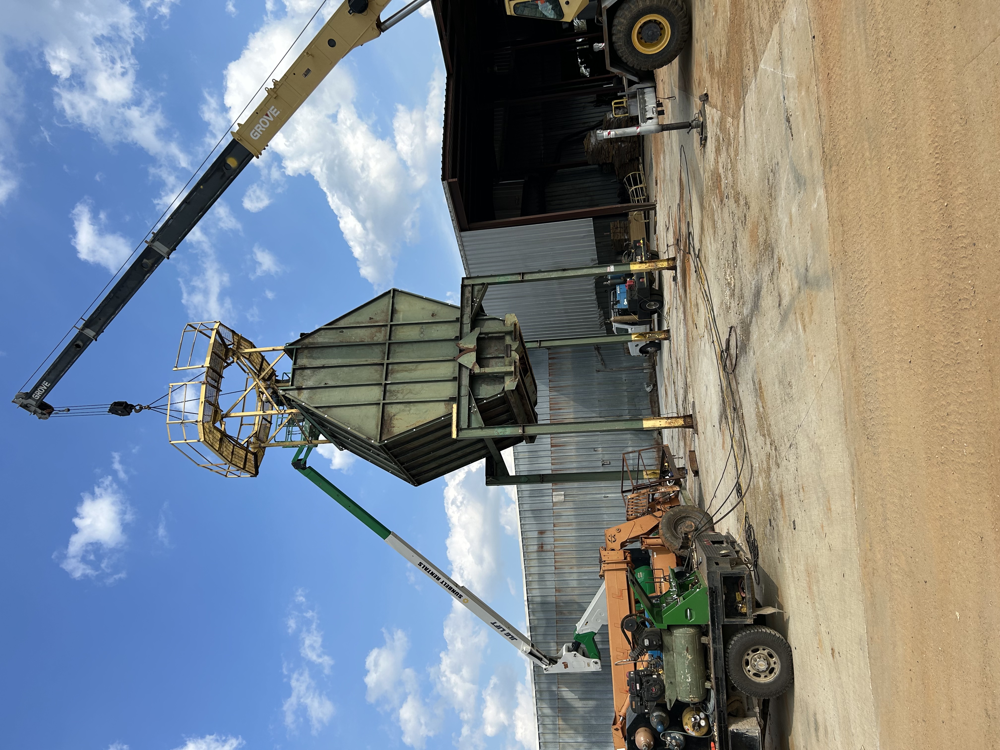 Industrial rigging and equipment setup with crane