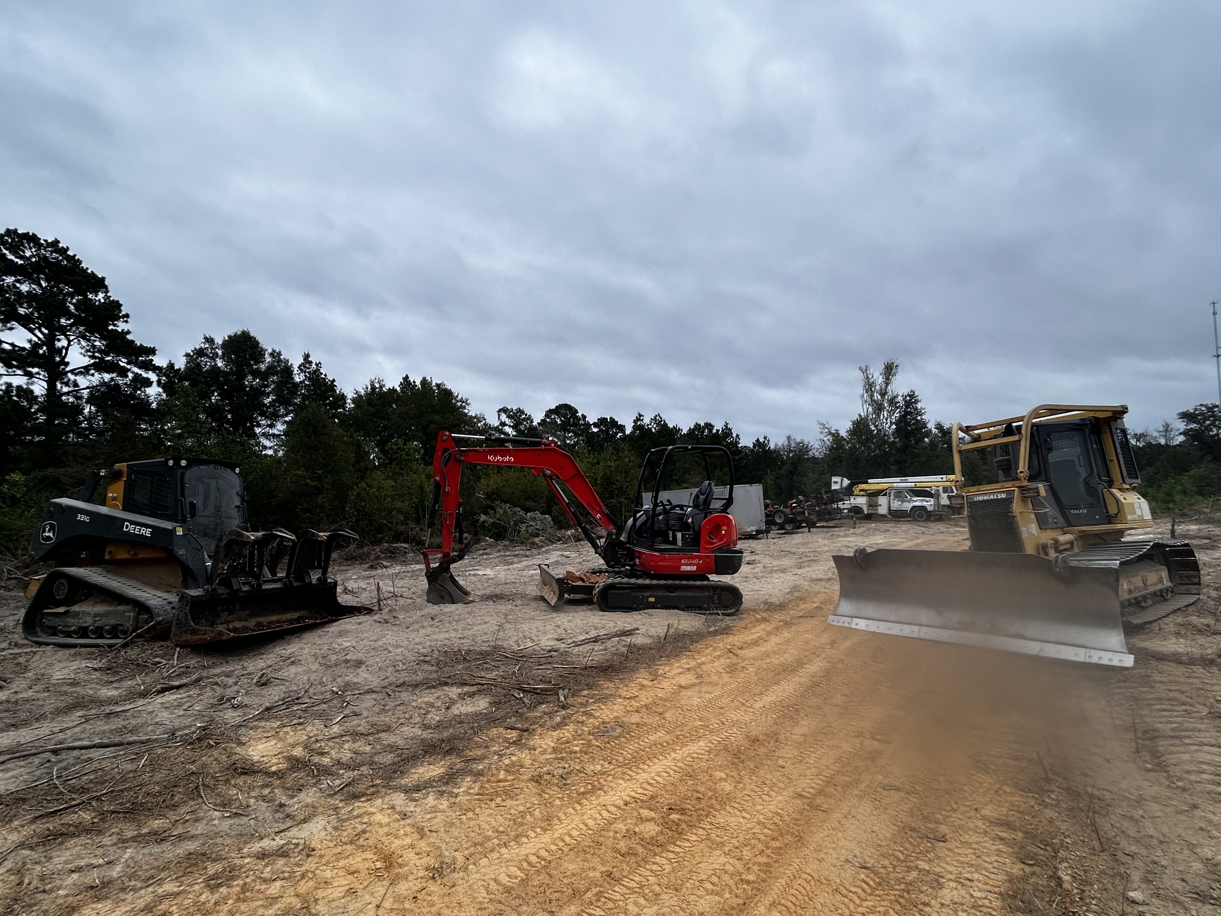 Skid steer, excavator, and dozer for land clearing